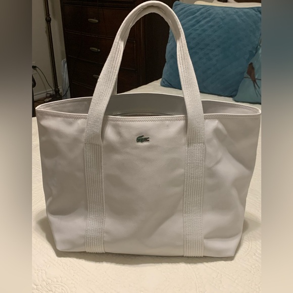 Lacoste Handbags - Lacoste OffWhite Large PreOwned Tote Bag inside clean outside blue light stains.